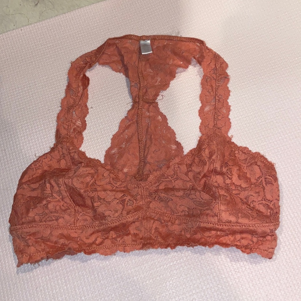 Burnt orange lace bralette. Size medium. NEVER WORN.